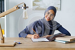 Gorgeous Muslim woman drawing