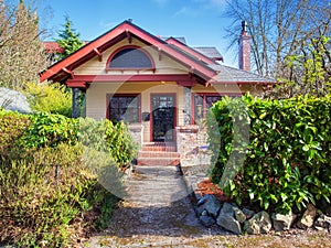 Gorgeous northwest home with red trim.