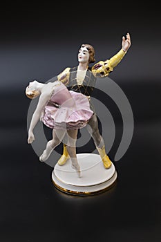 Gorgeous old figurine of a ballerina and her partner performing the adagio (slow part of the dance).