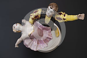 Gorgeous old figurine of a ballerina and her partner performing the adagio (slow part of the dance).