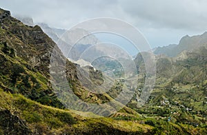 Gorgeous panorama view of a fertile Paul valley. Agriculture terraces in vertical valley sides, rugged peaks and motion