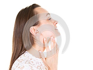 Gorgeous profile of young beauty woman with finger under chin thinking and closed eyes in copyspace over white studio background