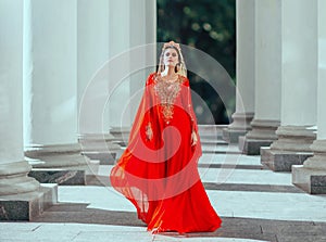 Gorgeous proud dark-haired confident haseki queen roksolana in amazing expensive luxury red long flying dress with