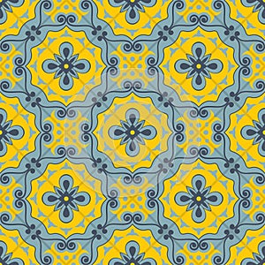 Gorgeous seamless patchwork pattern from blue and yellow Moroccan tiles, ornaments. photo