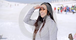 Gorgeous smiling young woman at a ski resort