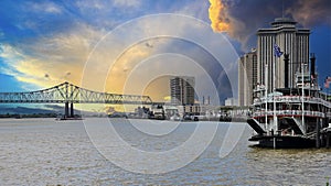 a gorgeous spring landscape along the Mississippi River with boats sailing and the Crescent City Connection bridge with hotels