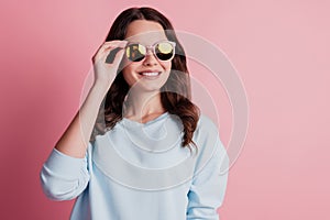 Gorgeous stunning lady posing in sunglass on pink background