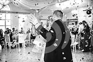 gorgeous stylish happy bride and groom performing their emotional first dance, wedding in a restaurant