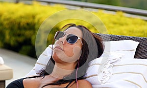 Gorgeous successful playboy model relaxing at pool in hotel resort in Costa Rica