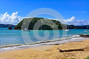 Gorgeous summer day in Paihia, Bay of Islands. Leisure boats anchored by the beach. Northland, New Zealand