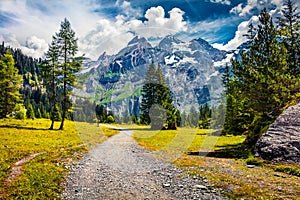 Gorgeous summer view of mountain range from the Oeschinen Lake. Incredible morning scene of Swiss Alps, Kandersteg village locatio