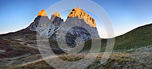 Gorgeous sunny view of Dolomite Alps with pastures. Colorful autumn scene of Langkofel, Sassolungo mountain range. Sella pass. photo