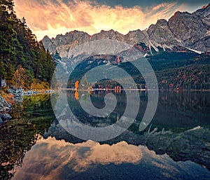 Gorgeous sunrise on Eibsee lake with Zugspitze peak on background.