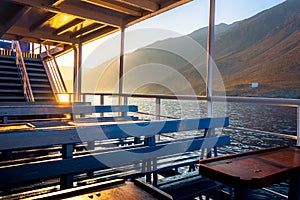 Gorgeous sunset from the deck of a ship, as it approaches the greek village of Loutro, Chania, Crete, Greece