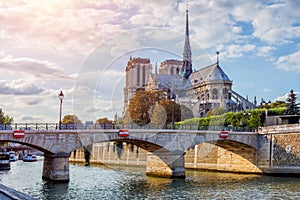 Gorgeous sunset over Notre Dame cathedral with clouds, Paris, France