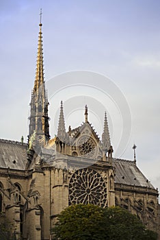 Gorgeous sunset over Notre Dame cathedral with puffy clouds, Paris, France.Notre Dame de Paris - Gothic Catholic Cathedral with