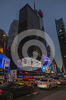 Gorgeous up view of colorful illuminated skyscrapers on night sky background. Manhattan. New York,