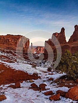 Gorgeous vertical sunrise shot of `Park Avenue` in Arches National Park in the winter with snow in Moab, Utah