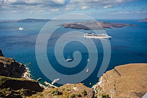 Gorgeous view of Aegean sea from Fira in Santorini, Greece. Cruise ships, boats and the caldera can be seen in the deep