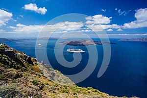 Gorgeous view of Aegean sea from Fira in Santorini, Greece. Cruise ships, boats and the caldera can be seen in the deep