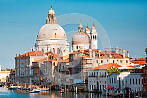 Gorgeous view of the Grand Canal and Basilica Santa Maria della Salute during sunset with interesting clouds, Venice, Italy