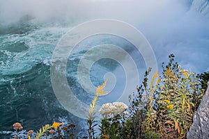 Gorgeous view of Niagara Falls landscape.Waves rumbling against the rocky shore. photo