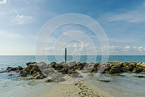 Gorgeous view of rocky coast line landscape. Atlantic ocean turquoise water surface. Key West, Florida.