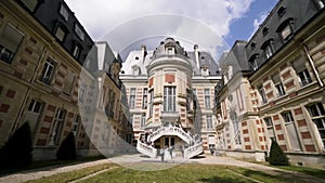 Gorgeous wedding being celebrated in a beautiful castle. Action. Group of people standing on the stairs ready for