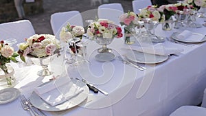Gorgeous wedding table setting for fine dining outdoors