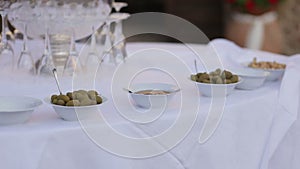 Gorgeous wedding table setting for fine dining outdoors decorated with flowers