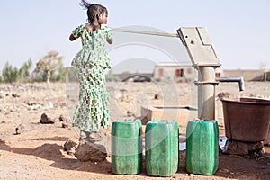 Gorgeous West African Girl Saving Fresh Water for a dehydration concept