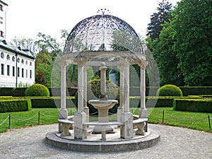 Gorgeous white pavilion with mini fountain of the English Garden