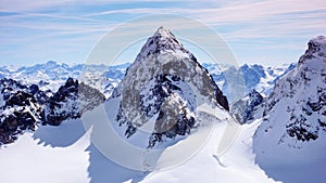 Gorgeous winter mountain landscape in the Swiss Alps with the famous summit of Piz Buin in the center