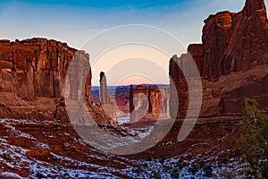 Gorgeous winter sunrise view of `Park Avenue` in Arches National Park with snow in Moab Utah