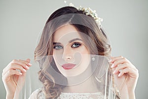 Gorgeous woman bride with makeup and bridal hair