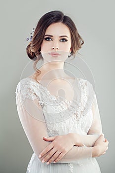 Gorgeous woman bride with makeup and updo hair