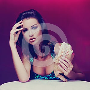 Gorgeous woman eating kebab in night club