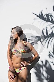 gorgeous woman in flowery bikini posing
