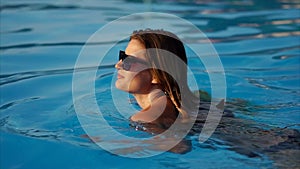 Gorgeous woman is going for a swim.