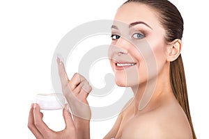 Gorgeous woman holding skin cream