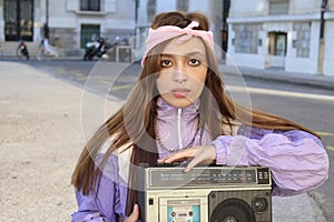 Gorgeous woman listening to music on the street