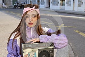 Gorgeous woman listening to music on the street