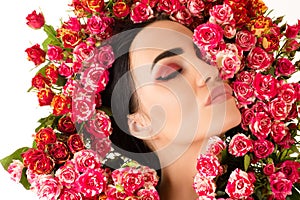 Gorgeous woman makeup face with red roses flower closeup