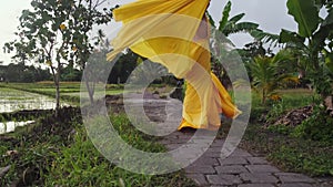 Gorgeous woman posing with her long dress outdoor