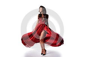 gorgeous woman in red dress. Studio picture, white background photo