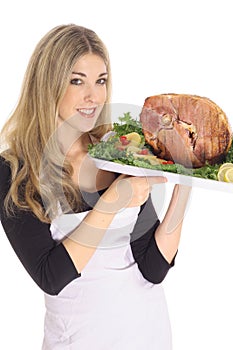 Gorgeous woman serving a ham