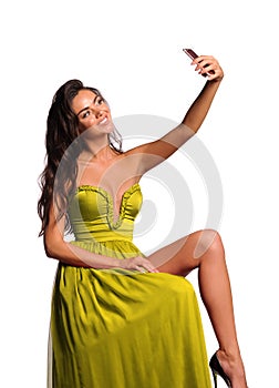 gorgeous woman in yellow dress. Studio picture, grey background