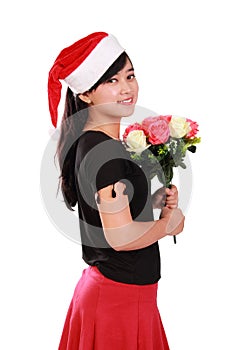 Gorgeous Xmas girl holding flowers bouquet