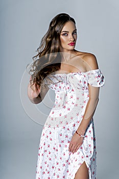 Gorgeous young adult woman posing in studio