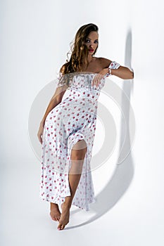 Gorgeous young adult woman posing in studio